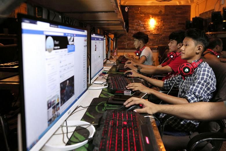Myanmar teens browsing Facebook at an Internet shop in Yangon. Facebook has removed hundreds of additional pages and accounts in Myanmar with hidden links to the military, the platform said yesterday, as the company scrambles to respond to criticism 