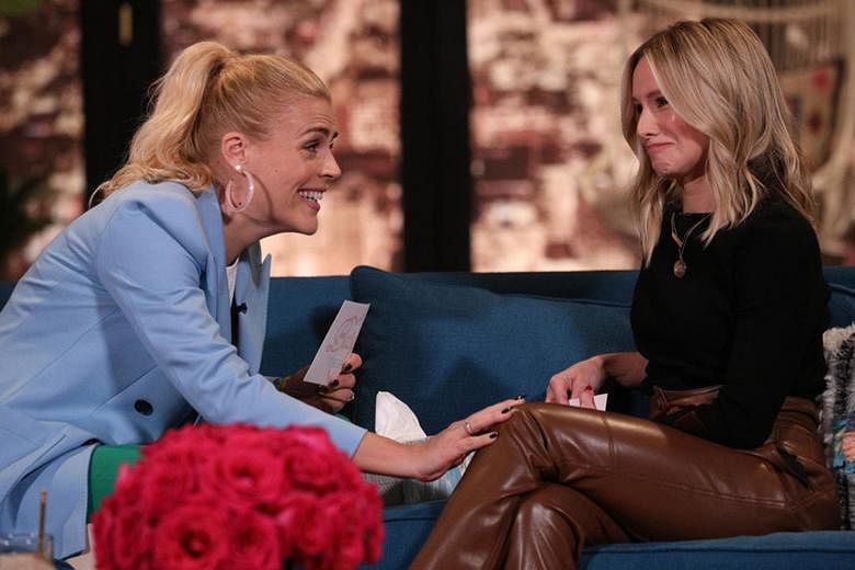 Busy Philipps (far left) interviewing actress Kristen Bell on her late-night talk show, Busy Tonight.