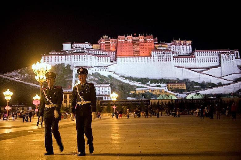 Chinese paramilitary policemen patrolling near Tibet's iconic Potala Palace in Lhasa in 2016. The US' Reciprocal Access to Tibet Act "denies Chinese government officials access to the US if they are responsible for creating or implementing restrictio