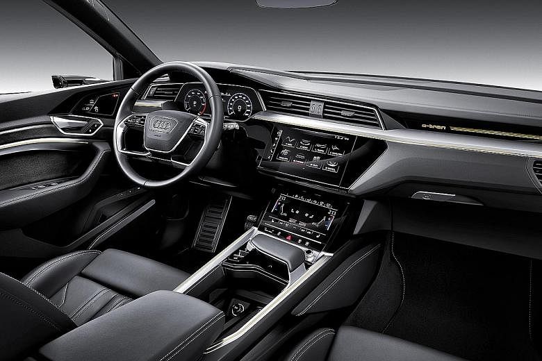 The Audi e-tron has some bespoke exterior features, such as a semi-blanked grille, pronounced fender bulges and wide rocker panel profiles along its flanks.