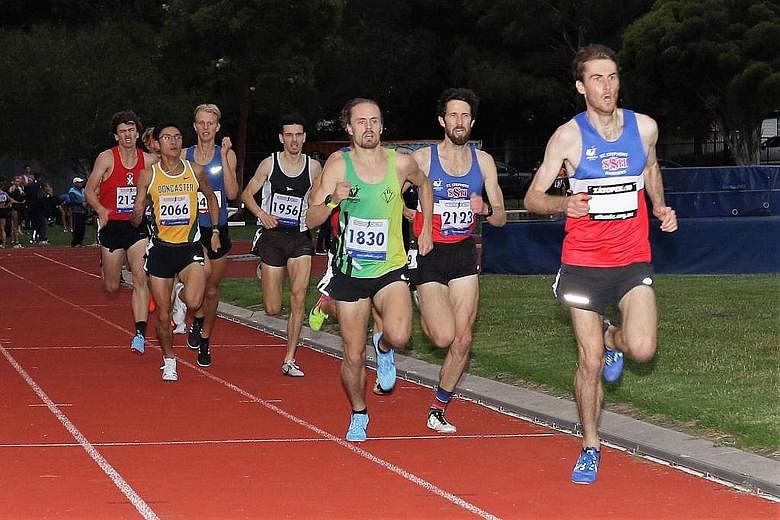 Lui Yuan Chow (in yellow), a first-year student at Melbourne's La Trobe University, on his way to breaking the national record during the Vic Milers meet in Melbourne on Thursday. He finished sixth.