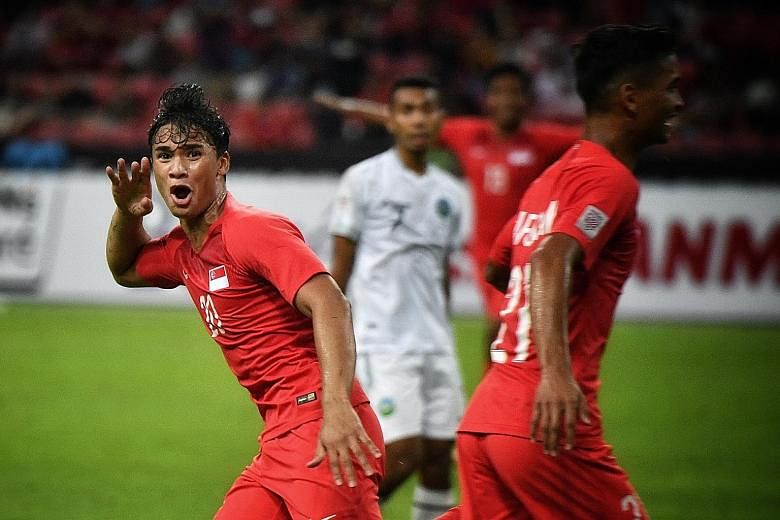 Lions forward Ikhsan Fandi celebrating after his brilliant bicycle-kick goal against Timor-Leste in the AFF Suzuki Cup Group B match on Nov 21.