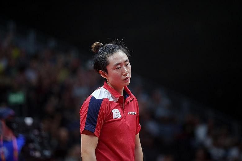Singapore's top women's paddler Feng Tianwei looking dejected in one of her matches at April's Commonwealth Games, where she failed to retain the singles title she won in 2014.