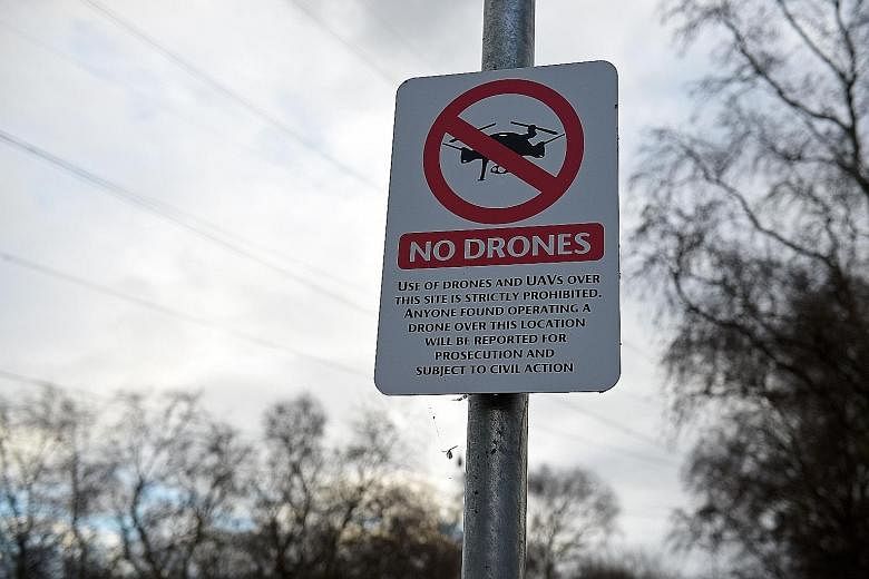 A sign saying use of drones or unmanned aerial vehicles is prohibited, near English football club Manchester United's training complex in Manchester.