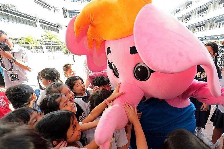 Methodist Girls' School pupils greeting Sharity, the Community Chest's mascot, at an event last year. There are a few ways to make a legacy gift to the Chest, and each gift goes a long way to help the needy.