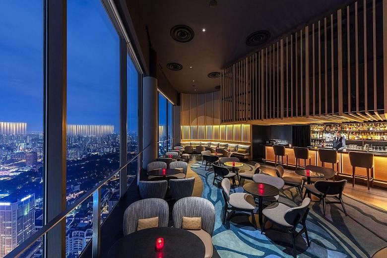Skai Bar (above) at Swissotel The Stamford, Manhattan bar (left) at Regent Singapore and Brass Lion Distillery (right) in Pasir Panjang stand out in the Singapore bar scene.