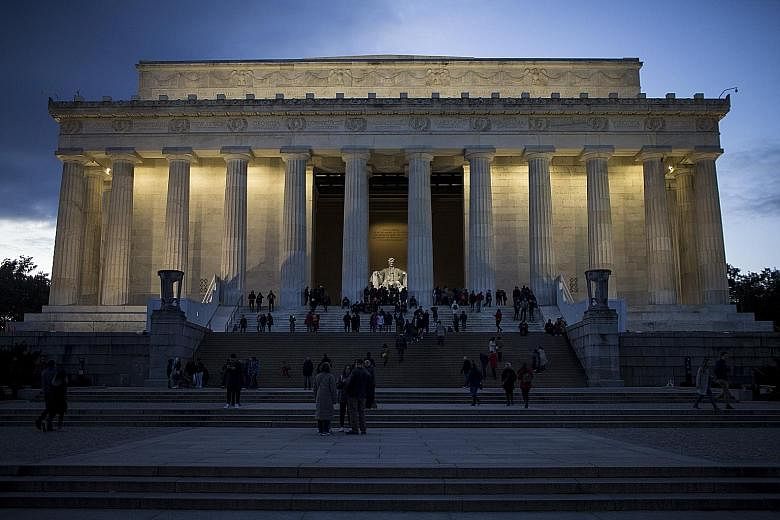 Visitors to the Lincoln Memorial in Washington on Saturday. A partial US government shutdown is set to drag through the Christmas holiday after an impasse over President Donald Trump's demand for more funds for a border wall. The political turmoil ad