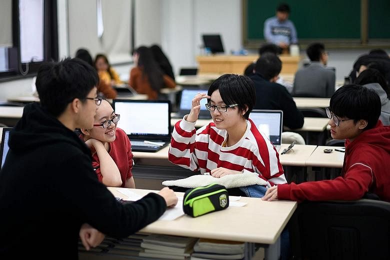 Students at the business school at Beijing's elite Renmin, which claims to be the first Chinese university to offer an MBA.
