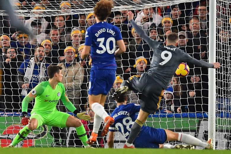Leicester City's Jamie Vardy scoring the only goal in their English Premier League match against Chelsea on Saturday, the Blues' first home loss of the season.