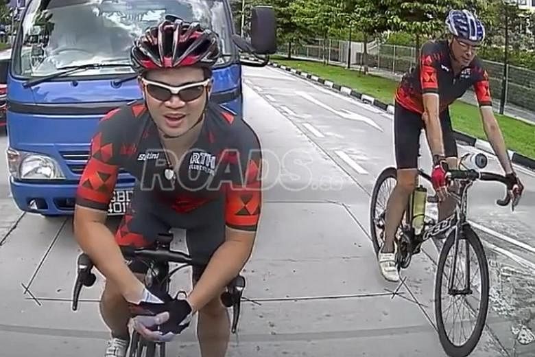 The video shows two cyclists, one of whom rides in front of the lorry and is knocked over after he hits its mirror.