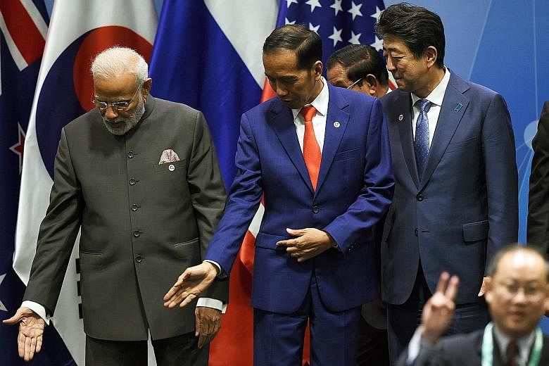 Indian Prime Minister Narendra Modi (left) and Indonesian President Joko Widodo face elections next year, and these have the potential to unnerve Asian credit markets if the incumbent leaders do not win as expected.