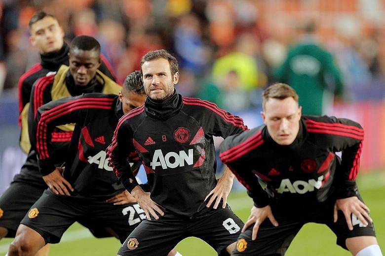 (From right) Phil Jones, Juan Mata and Antonio Valencia warming up before Manchester United's Champions League match against Valencia. Spurred by the arrival of caretaker manager Ole Gunnar Solskjaer, the team have a good chance to close the gap on t