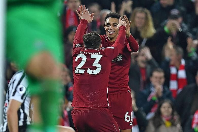 Liverpool's Trent Alexander-Arnold celebrating with Xherdan Shaqiri (No. 23) after laying on the ball for the Swiss midfielder to score in the 4-0 win over Newcastle on Boxing Day.