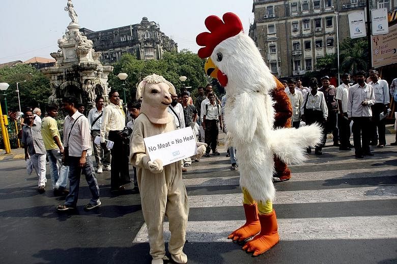 A demonstration to promote vegetarianism by People for the Ethical Treatment of Animals in Mumbai earlier this month. Reports show that vegetarianism in India has declined over the past decade.