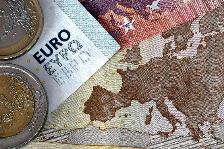 The euro reached a defining moment when the aftershocks of the 2008 financial crisis triggered a euro zone debt crisis. Experts say the turbulent time exposed the original flaws of the euro project, including the lack of fiscal solidarity through the