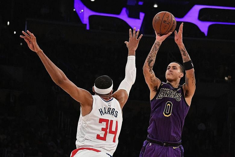 Los Angeles Lakers forward Kyle Kuzma attempting a shot over LA Clippers forward Tobias Harris in the game between the in-town rivals at Staples Centre on Friday night. Despite the Lakers enjoying a double-digit lead, the Clippers went on a 22-0 run 
