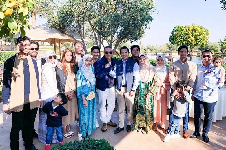 Umno's Datuk Seri Hishammuddin Hussein (centre, with sunglasses) and PKR's Datuk Seri Azmin Ali with their hands tightly clasped together. They were holidaying with their families in Marrakesh, Morocco.