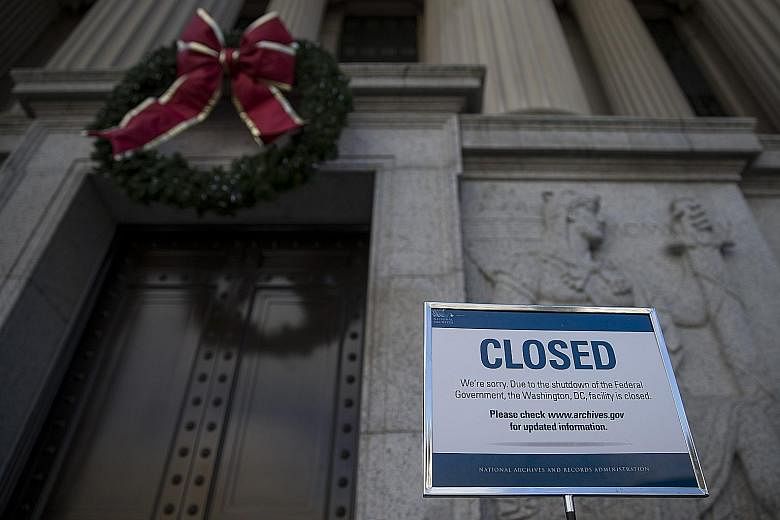 A sign announcing closure of the National Archives in Washington due to a partial government shutdown on display last Tuesday. The partial shutdown is set to be one of the longest in history, the result of an impasse between President Donald Trump an