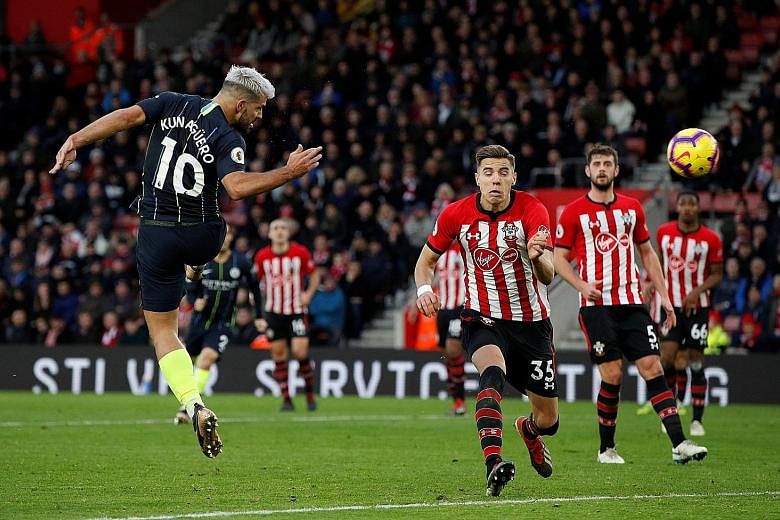 Sergio Aguero heads home Manchester City's third goal against Southampton just before half-time at St Mary's Stadium yesterday. The Argentinian's ninth league goal this season gave the champions a two-goal cushion, as Pep Guardiola's men returned to 