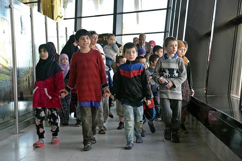Russian children whose mothers are in prison in Iraq for belonging to ISIS about to leave Baghdad International Airport on Sunday for their home country. The children, aged three to 10, were taken to hospital on arrival in Russia for thorough examina