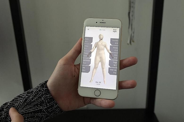 (Left) The 2m-tall scanner from Taiwan has sensors in its frame to capture a 3D image of a customer's body. (Right) The scanner is linked to a phone app and the measurements are sent to the tailor's phone with the 3D image, which can be spun around s