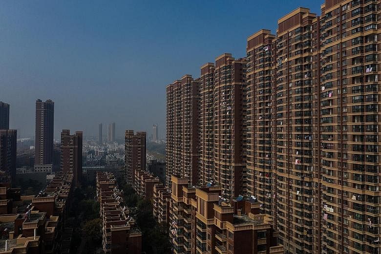 The Yudong International complex in Jurong, China. A glut of apartments across the country is partly blamed for a slowdown in the world's second-largest economy - and, by extension, dragging down growth around the world. In some places, home owners a