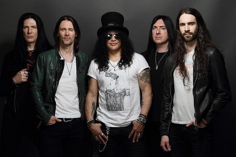 Hard rock guitarist Slash (centre) will be back to perform here with lead vocalist Myles Kennedy (second from left) and members of The Conspirators (from extreme left) Todd Kerns, Brent Fitz and Frank Sidoris in a show that will feature songs from th
