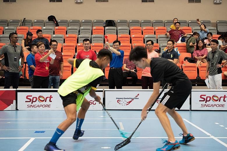 Finance Minister Heng Swee Keat, who is also the adviser to Tampines grassroots organisations, sounding the horn at Our Tampines Hub on Monday for one of the matches at Showdown 2018, a one-day event organised by the Singapore Floorball Association w