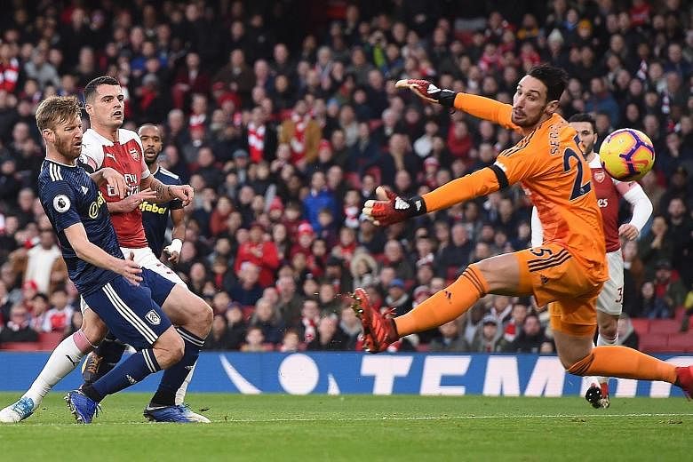 Arsenal midfielder Granit Xhaka stabbing the ball past Fulham goalkeeper Sergio Rico from close range to open accounts in a 4-1 English Premier League win at the Emirates Stadium in London yesterday. The visitors could have taken the lead in the firs