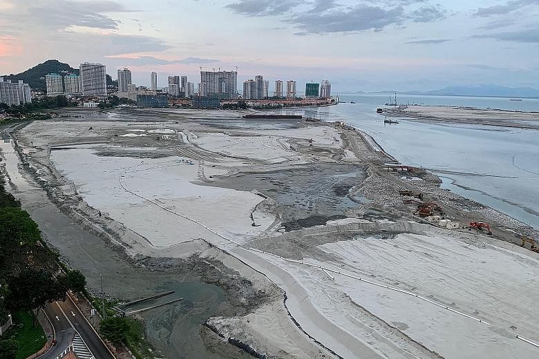 Land reclamation at Penang's famous Gurney Drive beachfront (above). To finance the transport masterplan, the state government is proposing to reclaim land to build three islands for development on Penang's south coast totalling 1,738ha, nearly four 