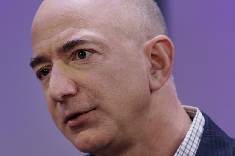 Amazon chief executive Jeff Bezos (top) was last year's biggest gainer, with his net worth growing US$24 billion to US$123 billion, while Facebook founder and CEO Mark Zuckerberg's (above) net worth fell nearly US$20 billion.