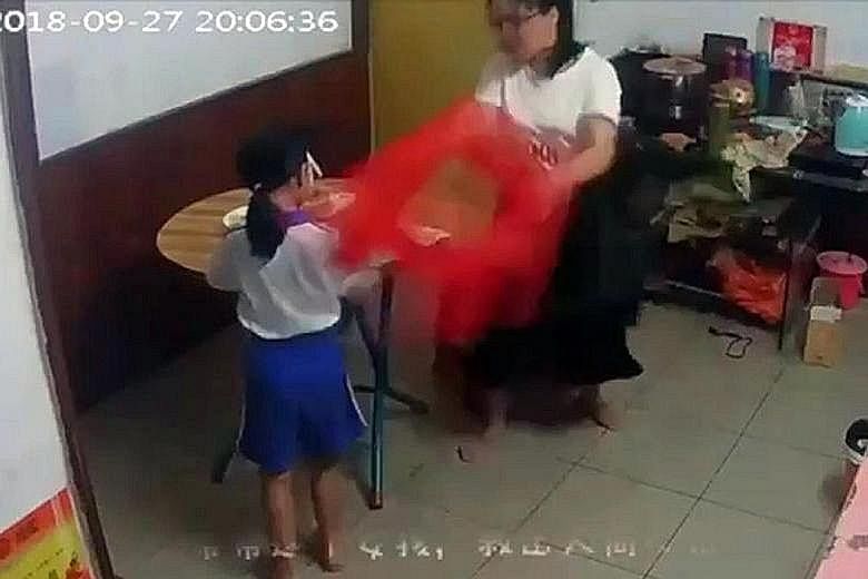 An online video clip showing the eight-year-old girl being beaten repeatedly by her mother in Shenzhen last September. The parents have since been arrested and are facing criminal penalties.