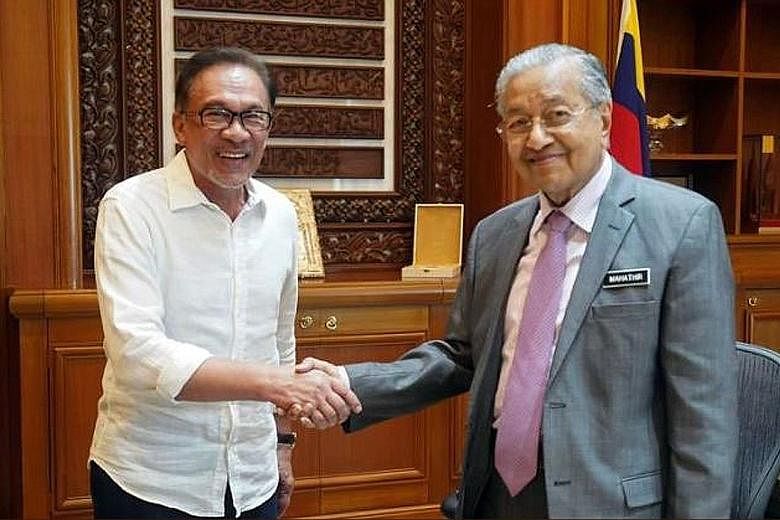 Datuk Seri Anwar Ibrahim (left) and Prime Minister Mahathir Mohamad met for an hour yesterday. Mr Anwar tweeted that they agreed on "the same strategies regarding Singapore"