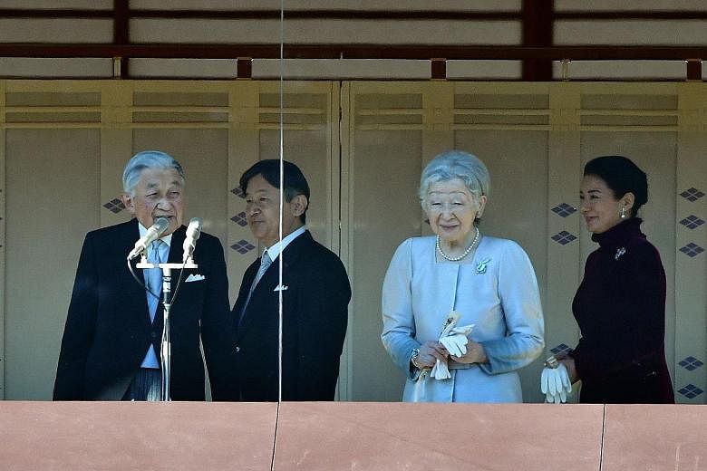 Members of the public queuing to enter the Imperial Palace for the traditional New Year appearance by the royal family yesterday. About 154,800 people flocked to the palace for a chance to see the 85-year-old monarch.