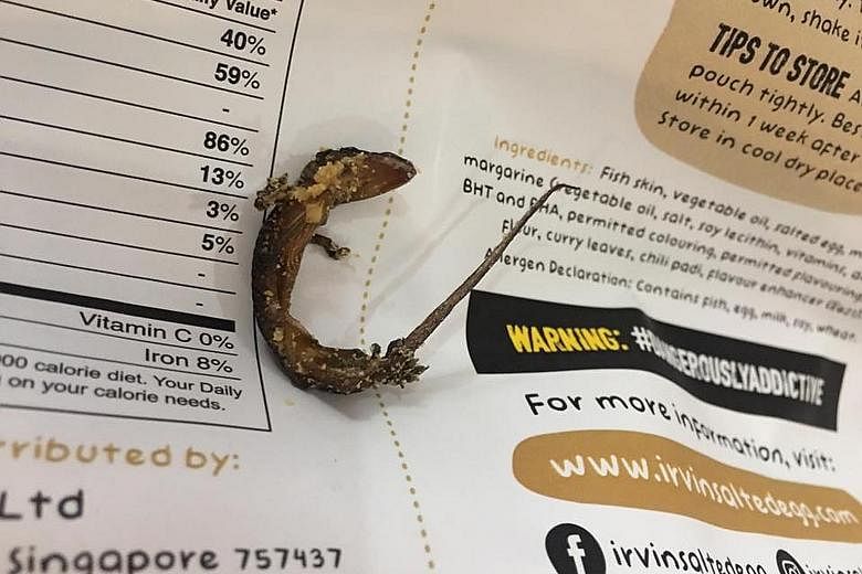 Ms Jane Holloway bought the snack in Bangkok in early November. Her brother initially thought the dead lizard was a baby salmon fish head. Irvins Salted Egg issued an apology yesterday. The Singapore-based food company is offering refunds for certain