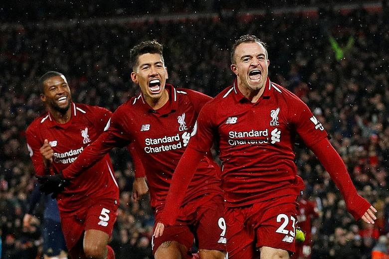 Liverpool's Xherdan Shaqiri (right) celebrating his second goal with Roberto Firmino and Georginio Wijnaldum in the 3-1 Premier League home win over Manchester United on Dec 16.