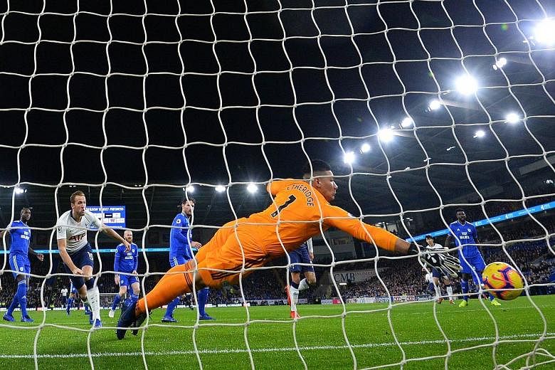Cardiff City goalkeeper Neil Etheridge is beaten just three minutes into their Premier League home match against Tottenham. Striker Harry Kane got lucky when a clearance hit his leg and rebounded into goal.