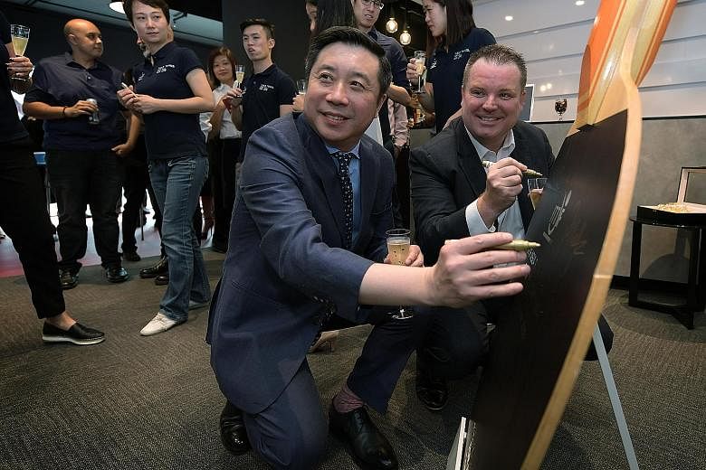 International Table Tennis Federation CEO Steve Dainton with Chinese businessman Frank Ji, whose shipping company Seamaster is a major sponsor of world table tennis, at the opening of the ITTF's new Asia-Pac office in Singapore.