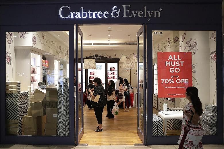 Half-empty shelves in Crabtree and Evelyn's VivoCity outlet yesterday. Long queues were seen at the United Kingdom-based bath and body product retailer's in-store closing-down sales in Singapore during the Christmas period, with discounts of up to 70