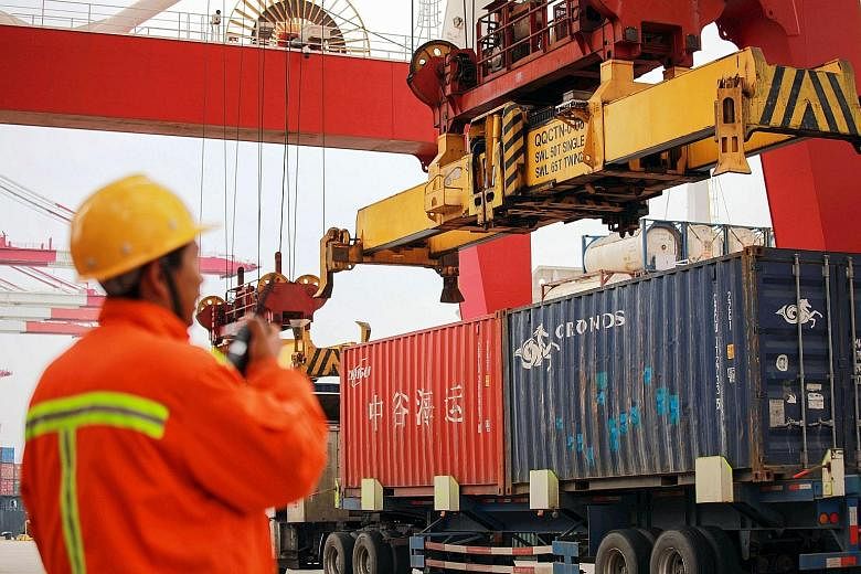 A Chinese worker at a port in Qingdao, China. President Donald Trump and President Xi Jinping agreed to a 90-day truce in the US-China trade war after a meeting in Argentina last month.