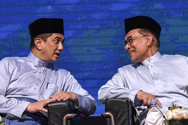 Parti Keadilan Rakyat (PKR) leader Anwar Ibrahim (right) chatting with PKR deputy president Azmin Ali last September. Mr Anwar's latest comments are seen as an acknowledgement of the tensions between the two of them.