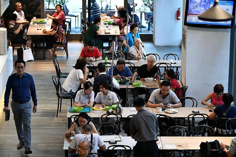 The NTUC Foodfare foodcourt at Khoo Teck Puat Hospital. The chain's foodcourts feature value meals and healthier options. Halim's fish soup comes with thick slices of fish.
