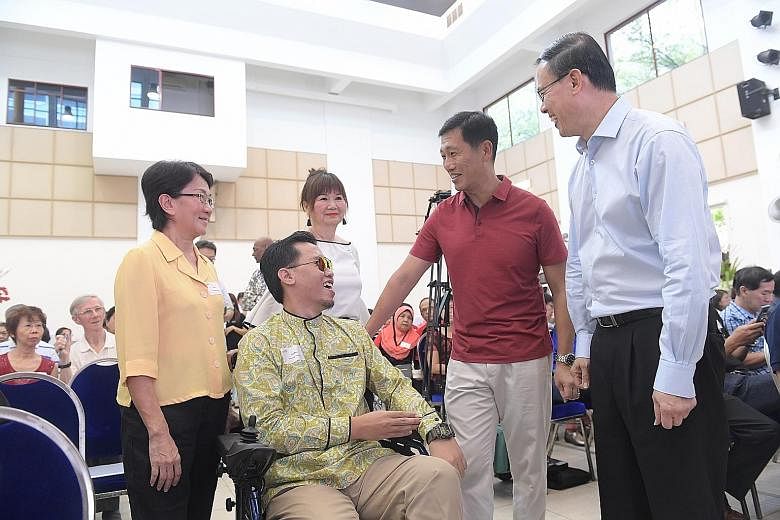Education Minister Ong Ye Kung and Mayor of North West District, Dr Teo Ho Pin, with Mr Muhammad Syafiq Mohammad Ali, Ms Jessie Tay (left), 61, and Ms Pauline Chan, 62, at yesterday's event.
