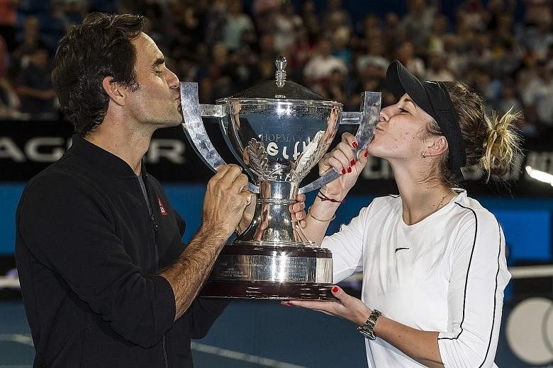 Switzerland's Roger Federer and his mixed doubles partner Belinda Bencic with the Hopman Cup, after defeating Germany's Alexander Zverev and Angelique Kerber in yesterday's final.