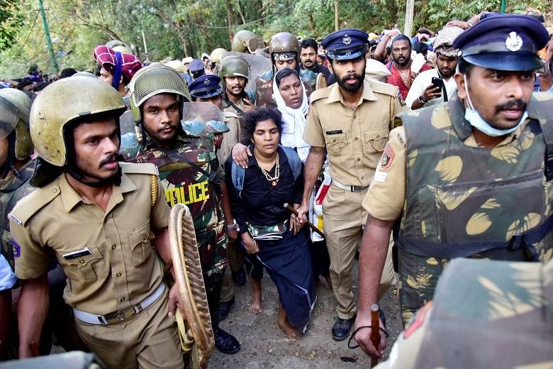 The two women who caused the furore - Ms Bindu Ammini, 42, and Ms Kanaka Durga, 44 - being escorted by police after they tried to enter the Sabarimala temple in December last year.