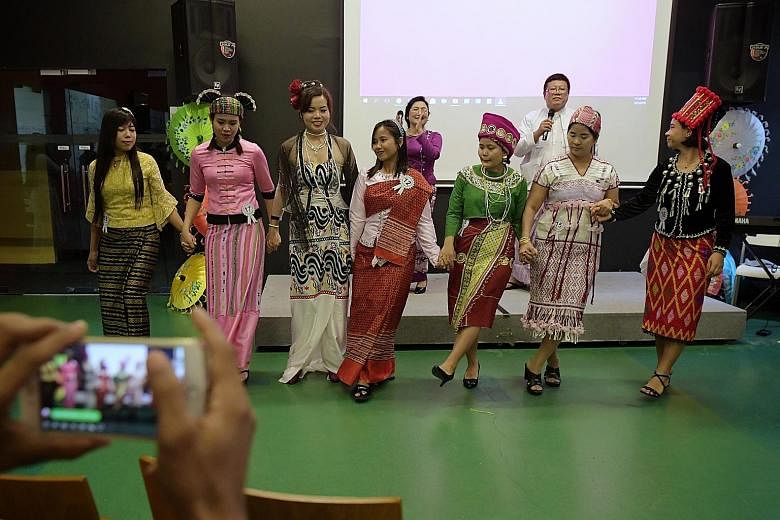 Myanmar domestic workers dressed in their ethnic costumes performing a dance as the Foreign Domestic Worker Association for Social Support and Training (Fast) celebrated Myanmar's 71st Independence Day, which fell on Friday. Yesterday's event was hel