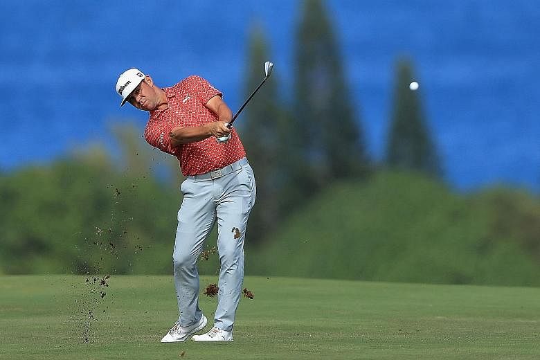 Gary Woodland nailed a spectacular eagle on the 15th hole and added a birdie on 18th at the Kapalua Plantation Course to restore a three-shot lead over Rory McIlroy at the Tournament of Champions in Hawaii on Saturday.