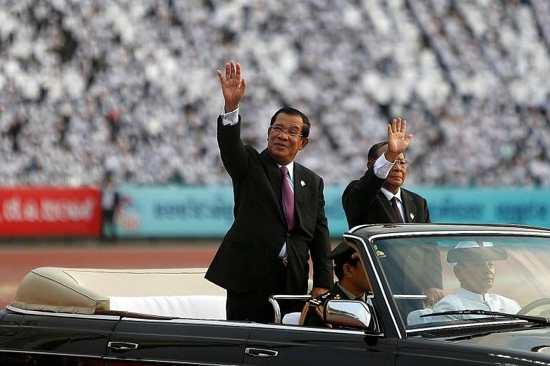 Prime Minister Hun Sen arriving at the event yesterday. The 66-year-old, who has been in power for 33 years, hailed the day as Cambodia's "second birthday". The ceremony marking the 40th anniversary of the expulsion of the Khmer Rouge regime, which r