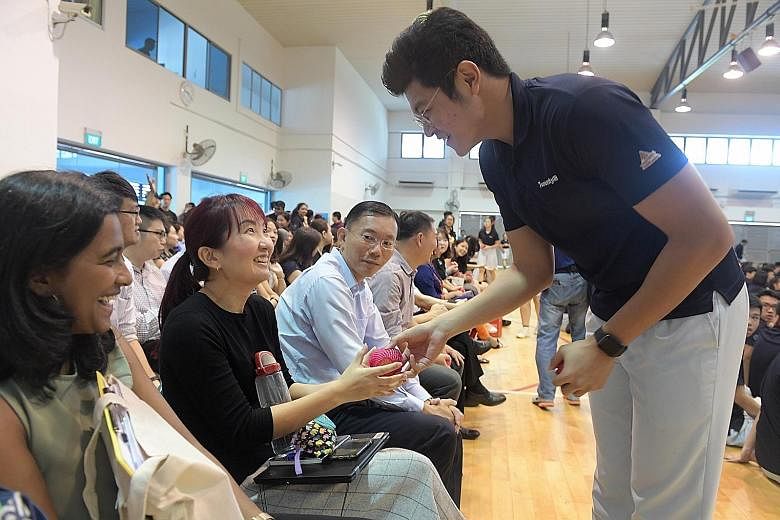 Clockwise from far left: TMJC student Clement Choo giving an apple to teacher Yeo-Chen Zhiling as a sign of appreciation; the school's friendly football match; and students having breakfast yesterday.
