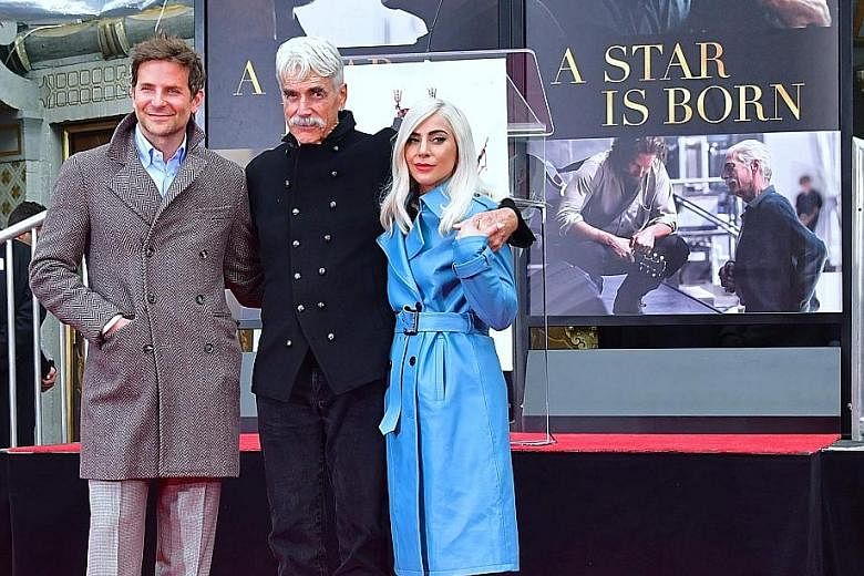 Lady Gaga (above right) and Bradley Cooper (left) did not let their Golden Globes disappointment mar the happiness of Sam Elliott (centre). They turned up on Monday to witness their 74-year-old A Star Is Born co-star imprint his hands and feet in cem